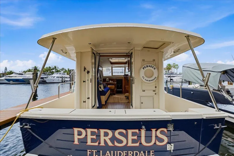 Perseus Yacht Photos Pics 2008 Mainship 34 Trawler Hardtop docked, featuring "Perseus" name and Fort Lauderdale location.