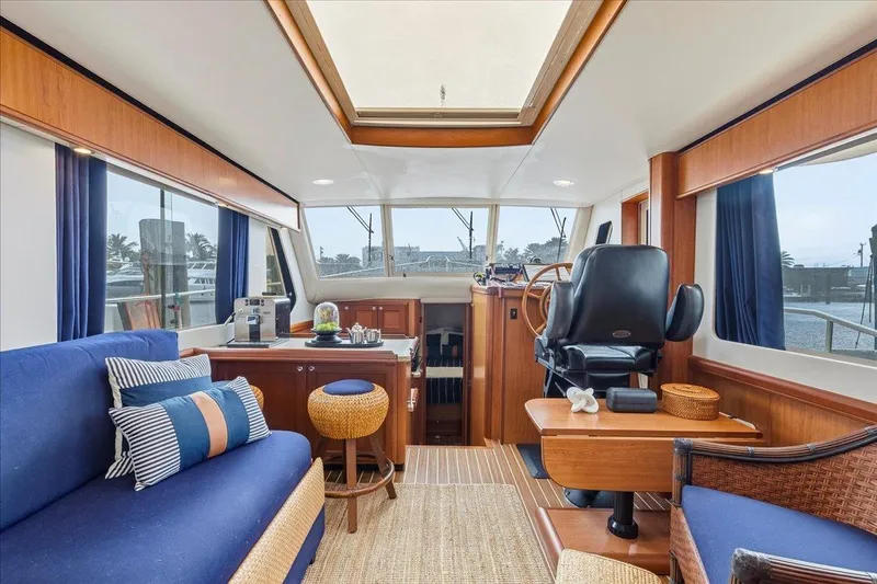 Perseus Yacht Photos Pics Interior of 2008 Mainship 34 Trawler Hardtop with cozy seating and helm station.