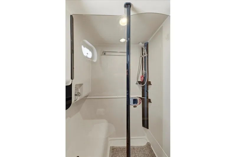 Perseus Yacht Photos Pics 2008 Mainship 34 Trawler Hardtop shower area with modern fixtures and lighting.