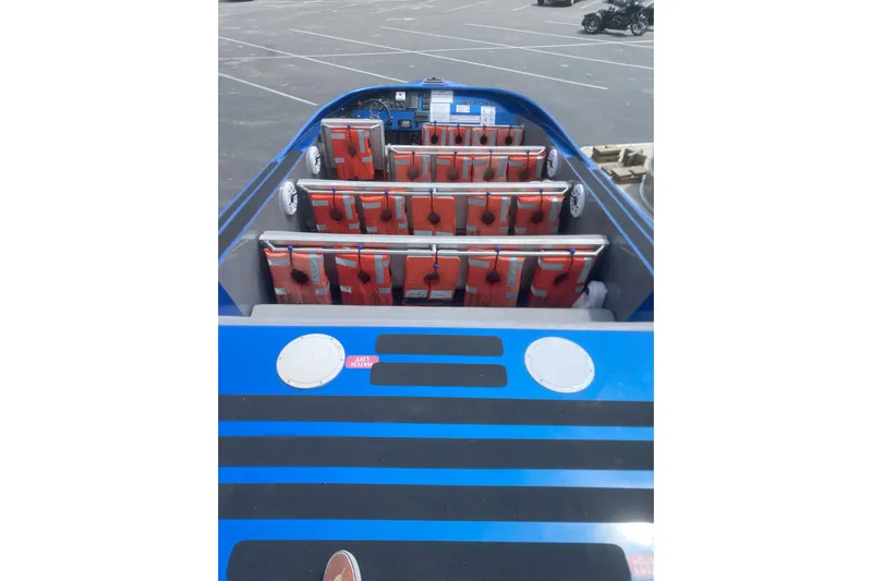  Yacht Photos Pics 2022 Smoky Mountain 16 Passenger boat interior with life jackets and seating arrangement.