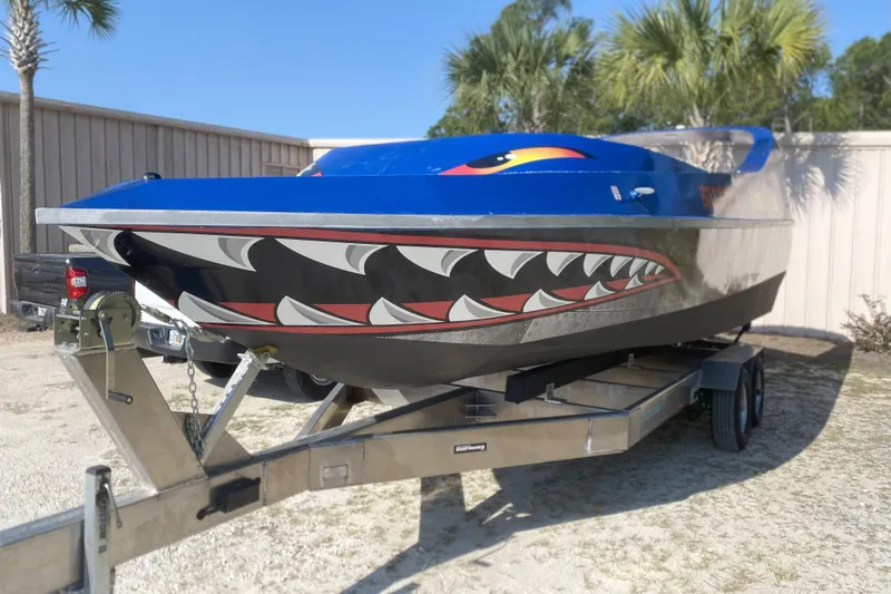  Yacht Photos Pics 2022 Smoky Mountain 16 Passenger boat with shark-themed design on trailer.