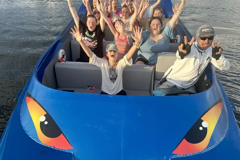  Yacht Photos Pics Group enjoying a ride on a 2022 Smoky Mountain 16 Passenger boat, smiling and raising hands.
