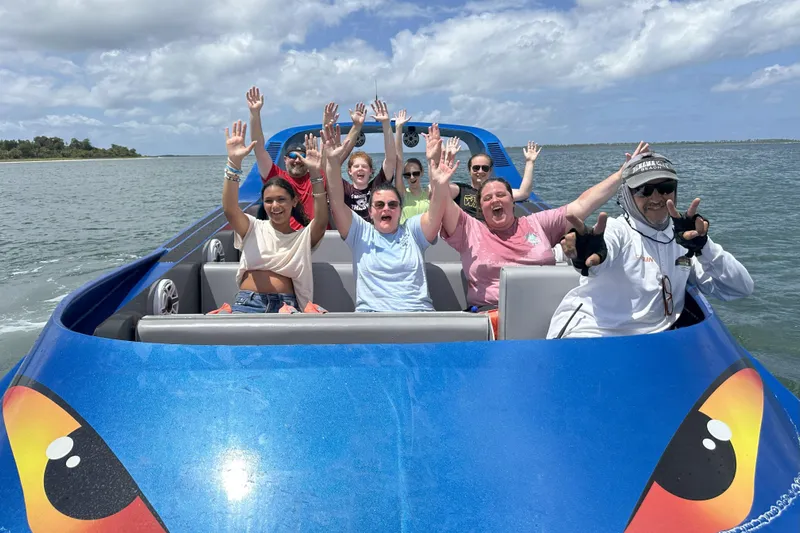  Yacht Photos Pics Group enjoying a ride on a 2022 Smoky Mountain 16 Passenger boat, smiling and raising hands.