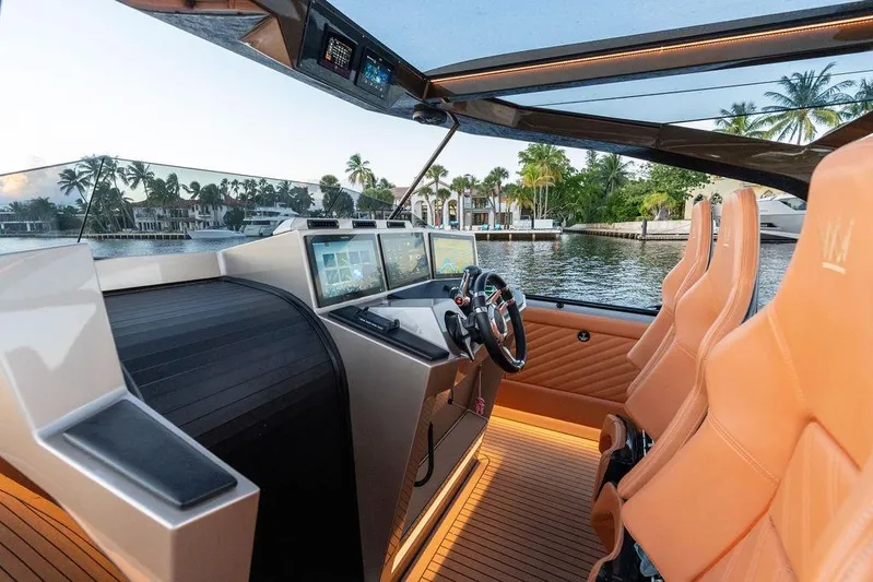  Yacht Photos Pics Luxurious 2023 DeKoning 43 yacht interior with advanced navigation system and plush seating.
