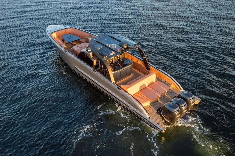  Yacht Photos Pics Luxury DeKoning 43 yacht cruising on open water, 2023 model, with sleek design and powerful engines.