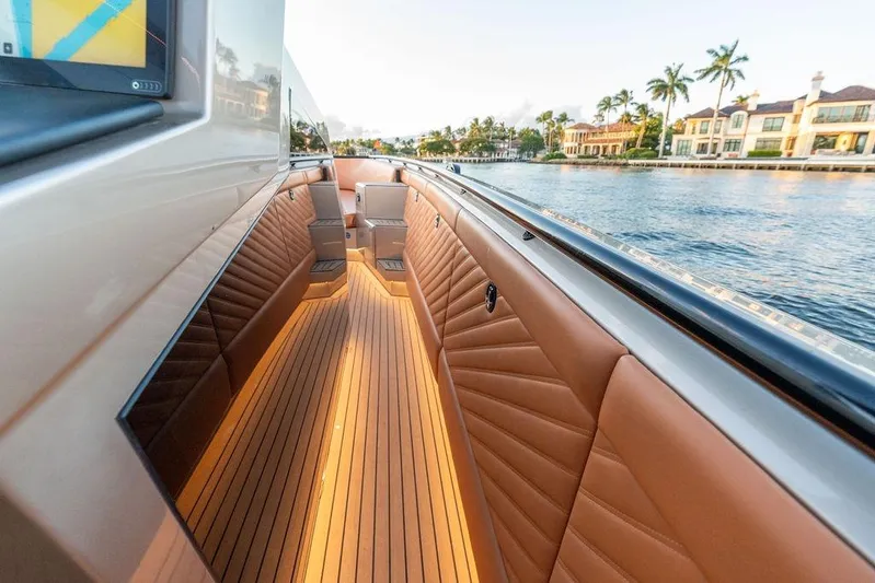  Yacht Photos Pics Luxurious 2023 DeKoning 43 yacht interior with elegant seating and waterfront view.