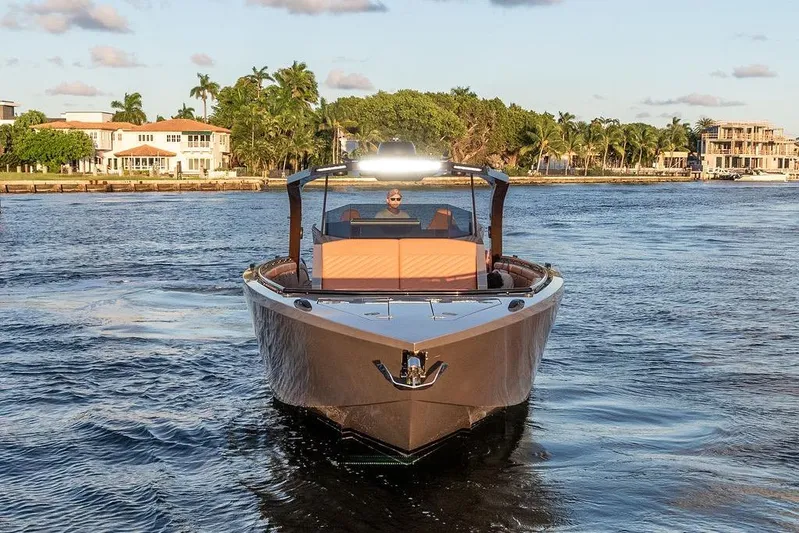  Yacht Photos Pics Luxury DeKoning 43 yacht cruising on a scenic waterway, 2023 model.