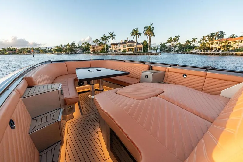  Yacht Photos Pics Luxurious 2023 DeKoning 43 yacht interior with elegant seating and scenic waterfront view.