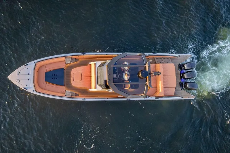 Yacht Photos Pics Aerial view of 2023 DeKoning 43 luxury yacht cruising on water.