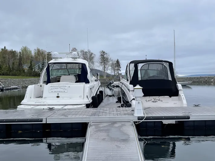 Northern Comfort Yacht Photos Pics Two boats docked at a marina, including a 2007 Sea Ray 40 Sundancer.