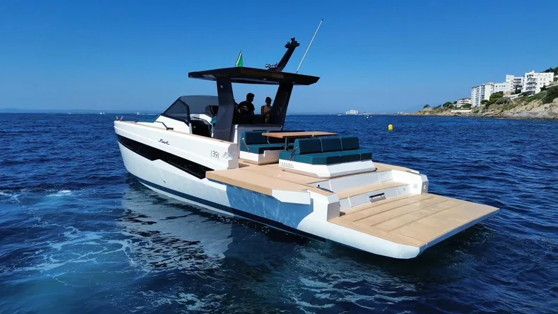 Fiart 39 Sw Yacht Photos Pics 2024 Fiart 39 Seawalker yacht cruising on blue ocean near coastline.