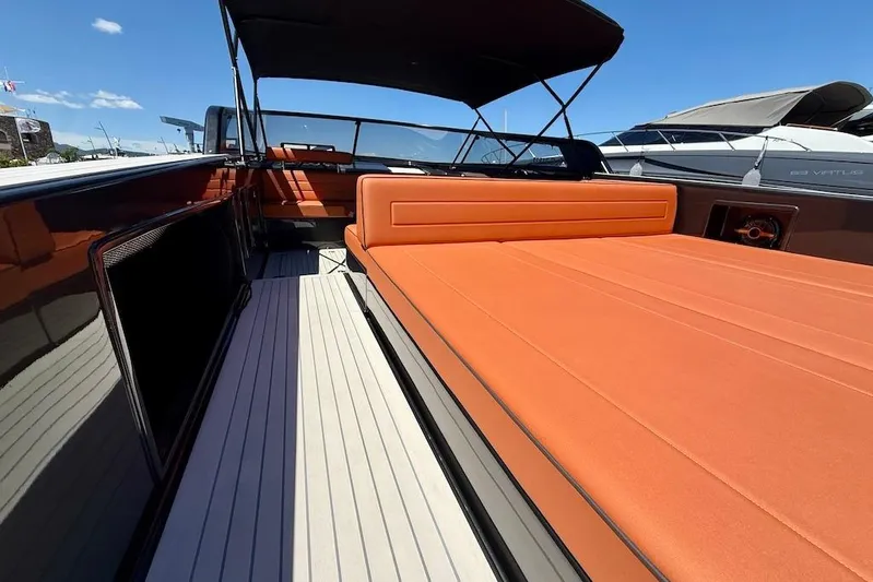 Must Yacht Photos Pics 2024 VanDutch 40 yacht with orange seating, sleek design, and spacious deck under clear skies.