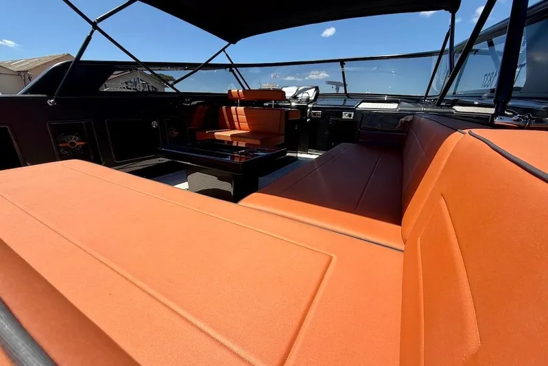 Must Yacht Photos Pics Luxurious interior of 2024 VanDutch 40 yacht with orange seating and sleek design.