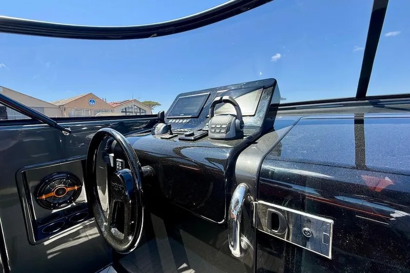 Must Yacht Photos Pics 2024 VanDutch 40 yacht dashboard with sleek black design and modern navigation equipment.