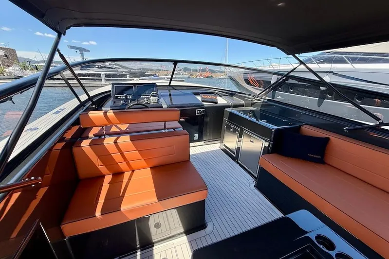 Must Yacht Photos Pics Luxurious 2024 VanDutch 40 yacht interior with orange seating and modern navigation equipment.