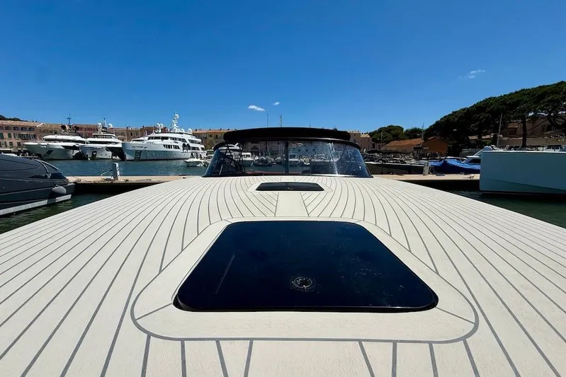 Must Yacht Photos Pics 2024 VanDutch 40 yacht docked in a marina under clear blue skies.