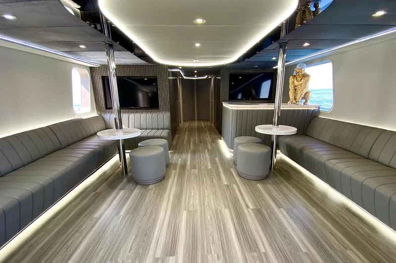  Yacht Photos Pics Luxurious interior of 2002 Custom Yacht 125 with modern seating and elegant decor.