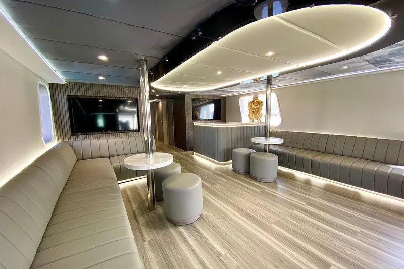  Yacht Photos Pics Luxurious interior of 2002 Custom Yacht 125 with modern seating and elegant lighting.