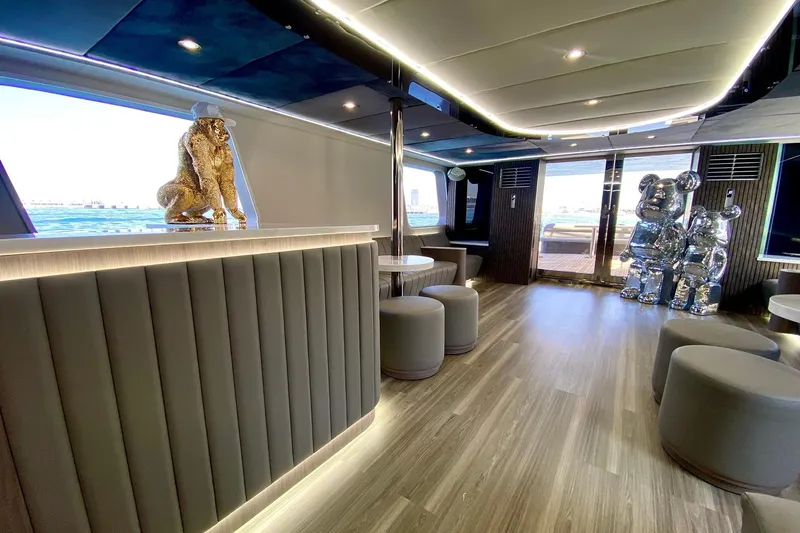  Yacht Photos Pics Luxurious yacht interior with modern decor, featuring sculptures and elegant seating, Custom Yacht 125, 2002.