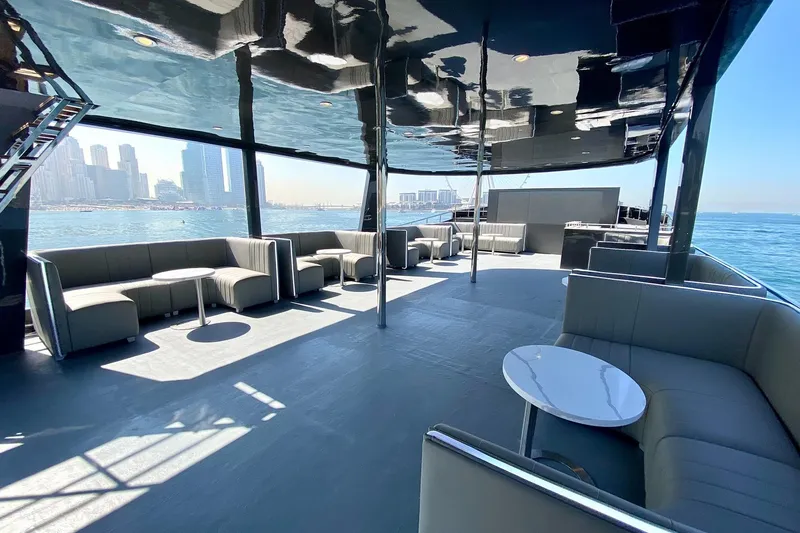  Yacht Photos Pics Luxurious 2002 Custom Yacht 125 with spacious deck and modern seating, overlooking city skyline.