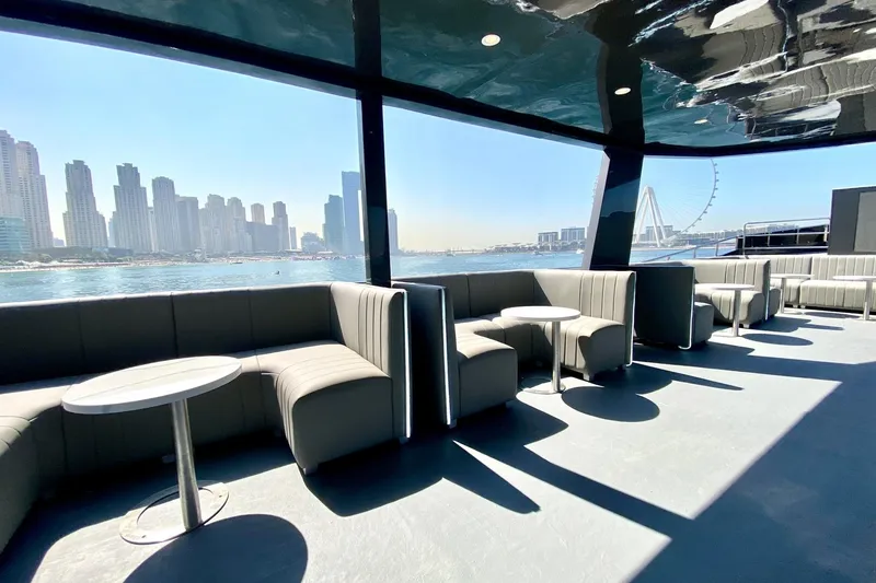  Yacht Photos Pics Luxurious 2002 Custom Yacht 125 interior with modern seating, overlooking city skyline and waterfront.