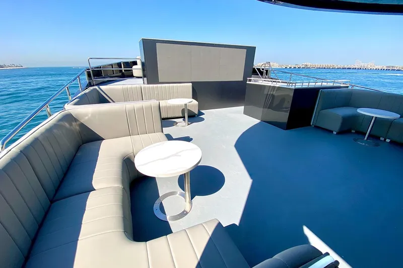  Yacht Photos Pics Luxurious 2002 Custom Yacht 125 deck with elegant seating and ocean view.