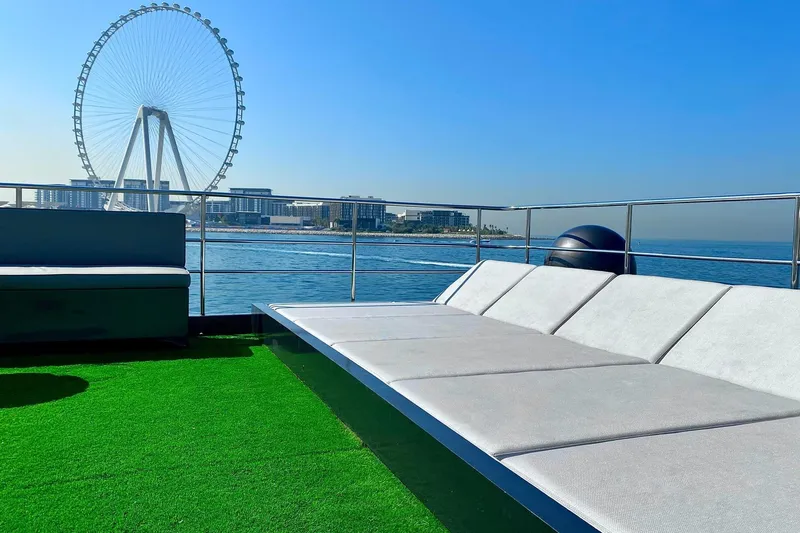  Yacht Photos Pics Luxurious Custom Yacht 125 deck with cityscape and Ferris wheel view, 2002 model.