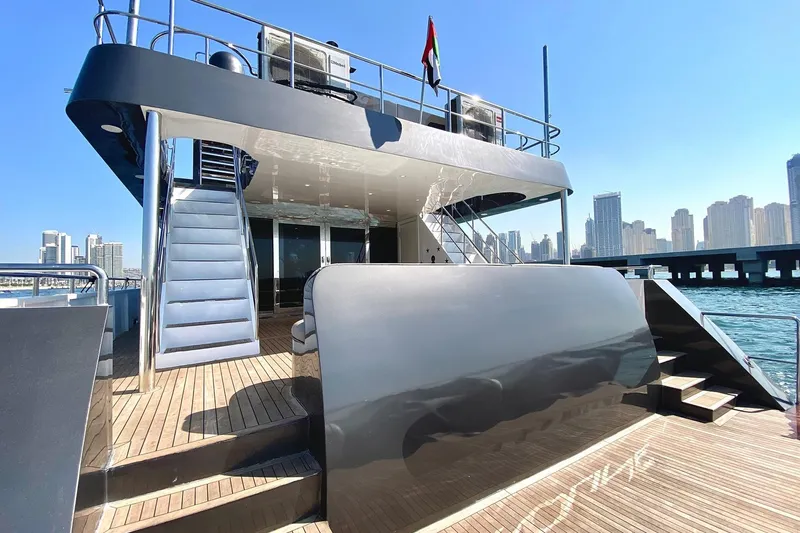  Yacht Photos Pics Luxurious 2002 Custom Yacht 125 with city skyline and waterfront view.
