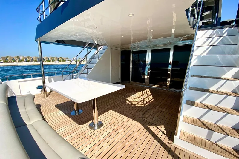  Yacht Photos Pics Luxurious 2002 Custom Yacht 125 deck with modern seating and ocean view.