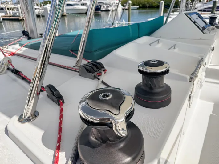 Sunshine Yacht Photos Pics Deck of 2017 Lagoon 450 F catamaran with winches and ropes, docked at marina.