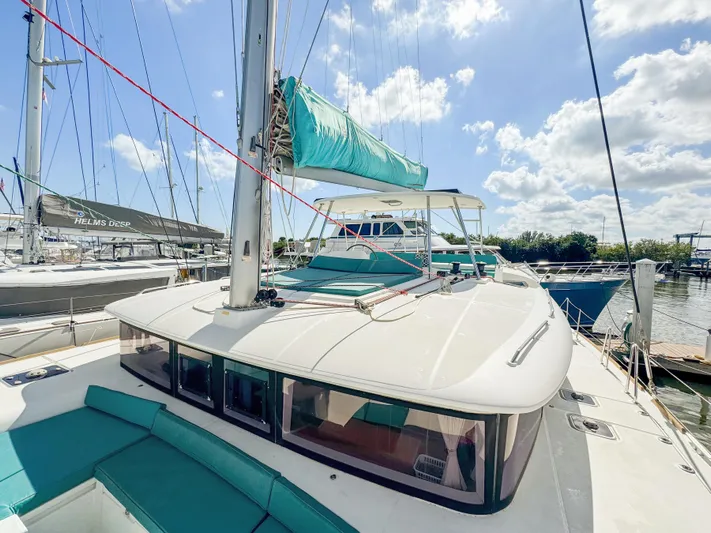 Sunshine Yacht Photos Pics 2017 Lagoon 450 F catamaran docked under a sunny sky.
