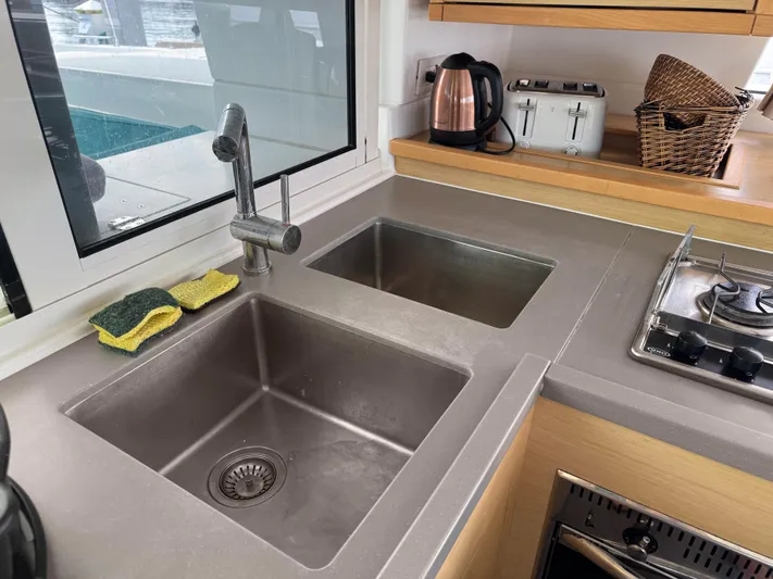 Sunshine Yacht Photos Pics Modern kitchen sink and countertop on a 2017 Lagoon 450 F catamaran.