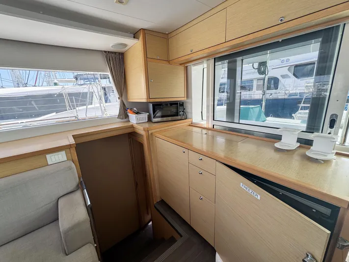 Sunshine Yacht Photos Pics Interior of 2017 Lagoon 450 F catamaran with modern kitchen and ample storage.