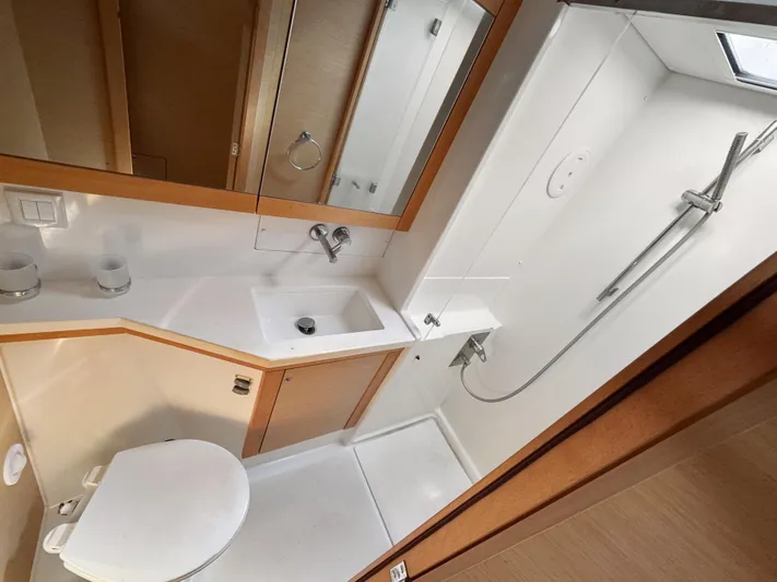 Sunshine Yacht Photos Pics Bathroom interior of 2017 Lagoon 450 F yacht, featuring modern fixtures and compact design.