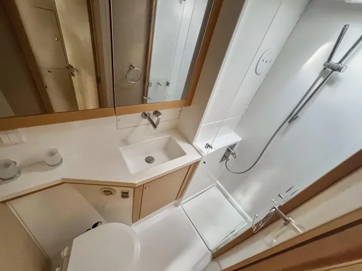 Sunshine Yacht Photos Pics Bathroom interior of 2017 Lagoon 450 F yacht, featuring sink, toilet, and shower.