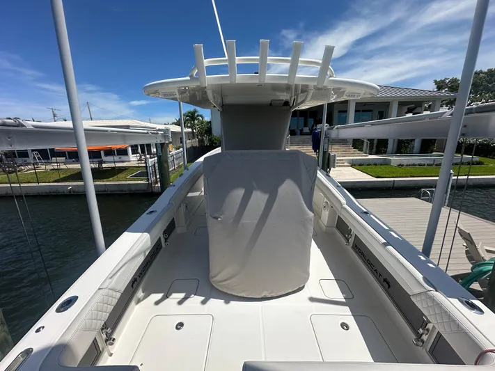  Yacht Photos Pics 2024 World Cat 280ccx boat docked, showcasing spacious deck and modern design.