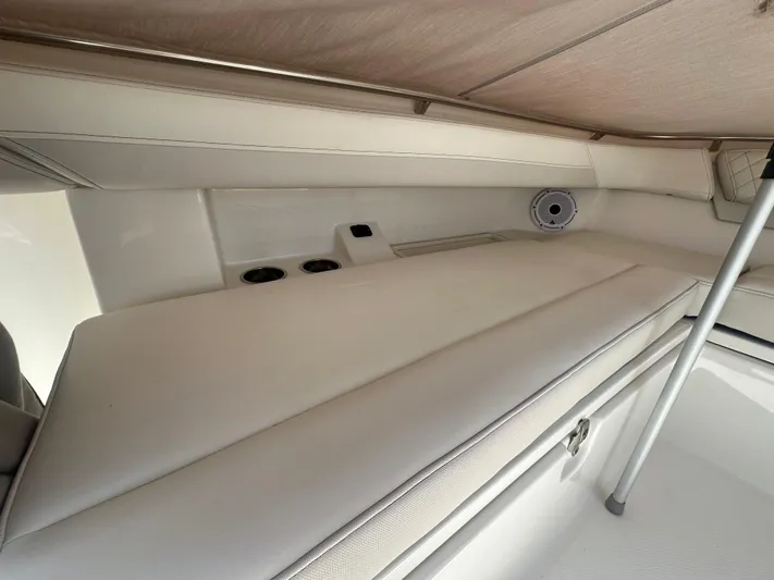 Yacht Photos Pics 2024 World Cat 280ccx interior cabin with cushioned seating and speaker system.