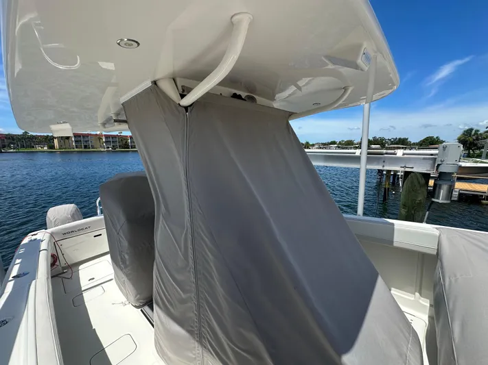  Yacht Photos Pics 2024 World Cat 280ccx boat with covered console, docked by the water.