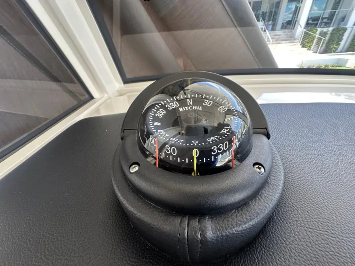  Yacht Photos Pics Compass on 2024 World Cat 280ccx boat dashboard, displaying navigation directions.