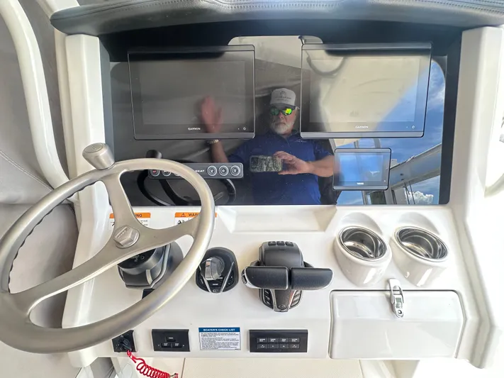  Yacht Photos Pics 2024 World Cat 280ccx helm with dual Garmin displays and modern controls.