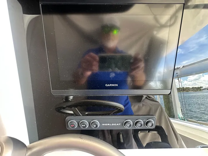  Yacht Photos Pics 2024 World Cat 280ccx dashboard with Garmin display and control panel.