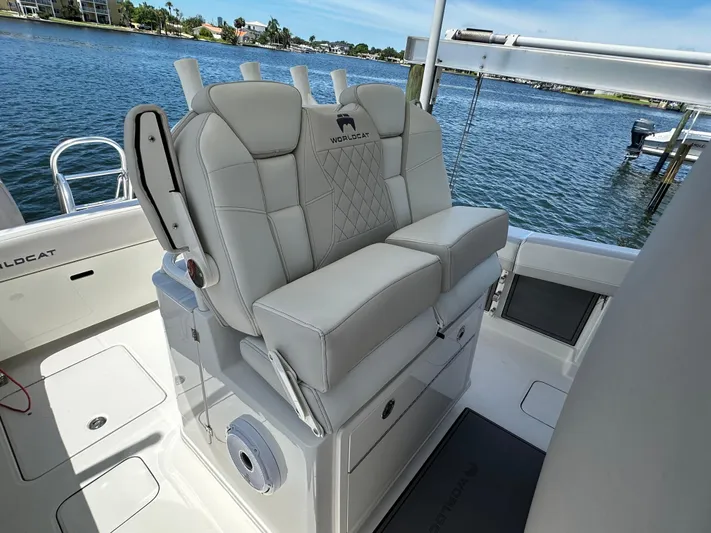  Yacht Photos Pics 2024 World Cat 280ccx boat interior with luxurious seating and waterfront view.