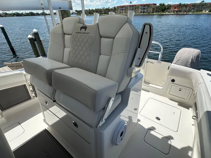  Yacht Photos Pics 2024 World Cat 280ccx boat interior with luxurious seating and waterfront view.