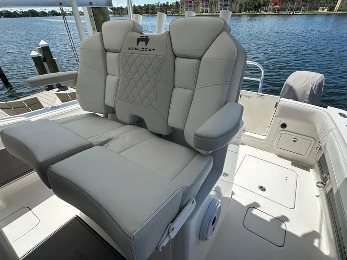  Yacht Photos Pics 2024 World Cat 280ccx boat seating with luxurious upholstery by the water.