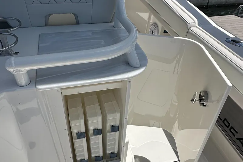  Yacht Photos Pics 2024 World Cat 280ccx boat interior with storage compartments and seating area.