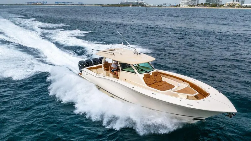  Yacht Photos Pics 2018 Scout 420 LXF boat cruising on open water, showcasing luxury and performance.