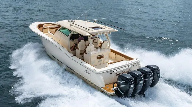  Yacht Photos Pics 2018 Scout 420 LXF boat cruising on open water with four Mercury engines.