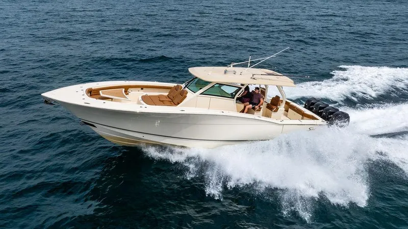  Yacht Photos Pics 2018 Scout 420 LXF boat cruising on open water, showcasing luxury and performance.