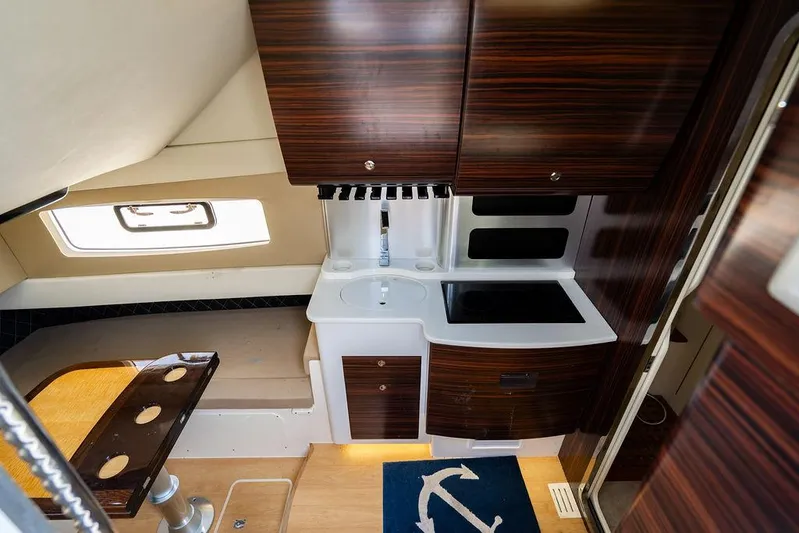  Yacht Photos Pics Luxurious interior of 2018 Scout 420 LXF yacht with modern kitchen and seating area.