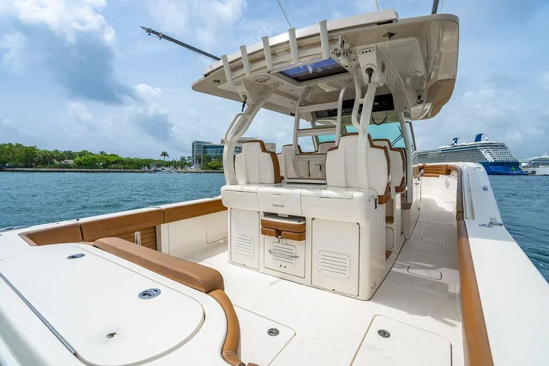  Yacht Photos Pics 2018 Scout 420 LXF boat on water, featuring luxurious seating and modern design.